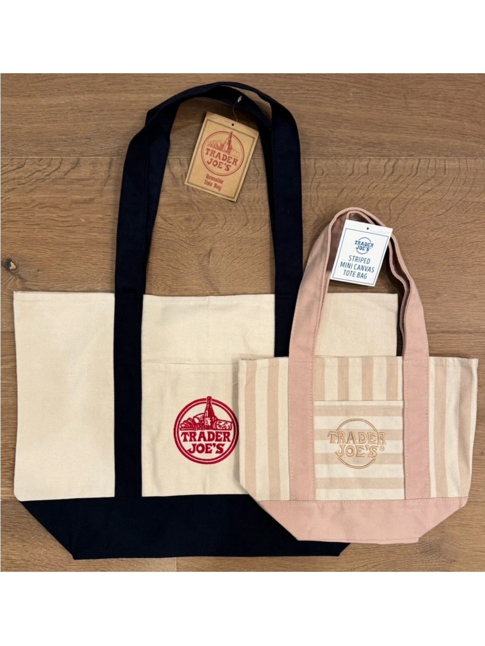 Set of 2 Trader Joe’s totes. One large cream/navy, One mini pastel pink stripe.